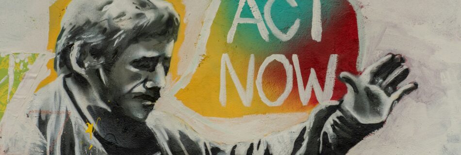 Mural reading 'act now'