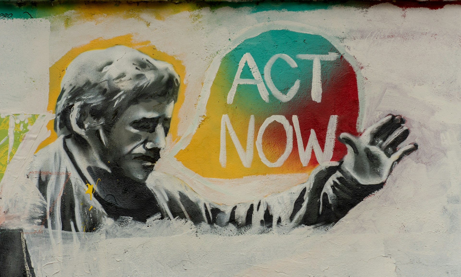 Mural reading 'act now'